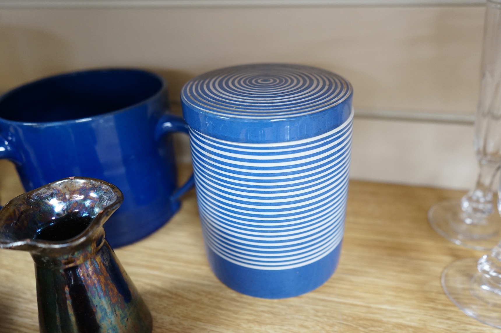A collection of pottery to include lustre glazed jugs and tygs, a T. G. Green storage jar, Carltonware ash tray and a miniature Ruskin style vase, largest 18cm high